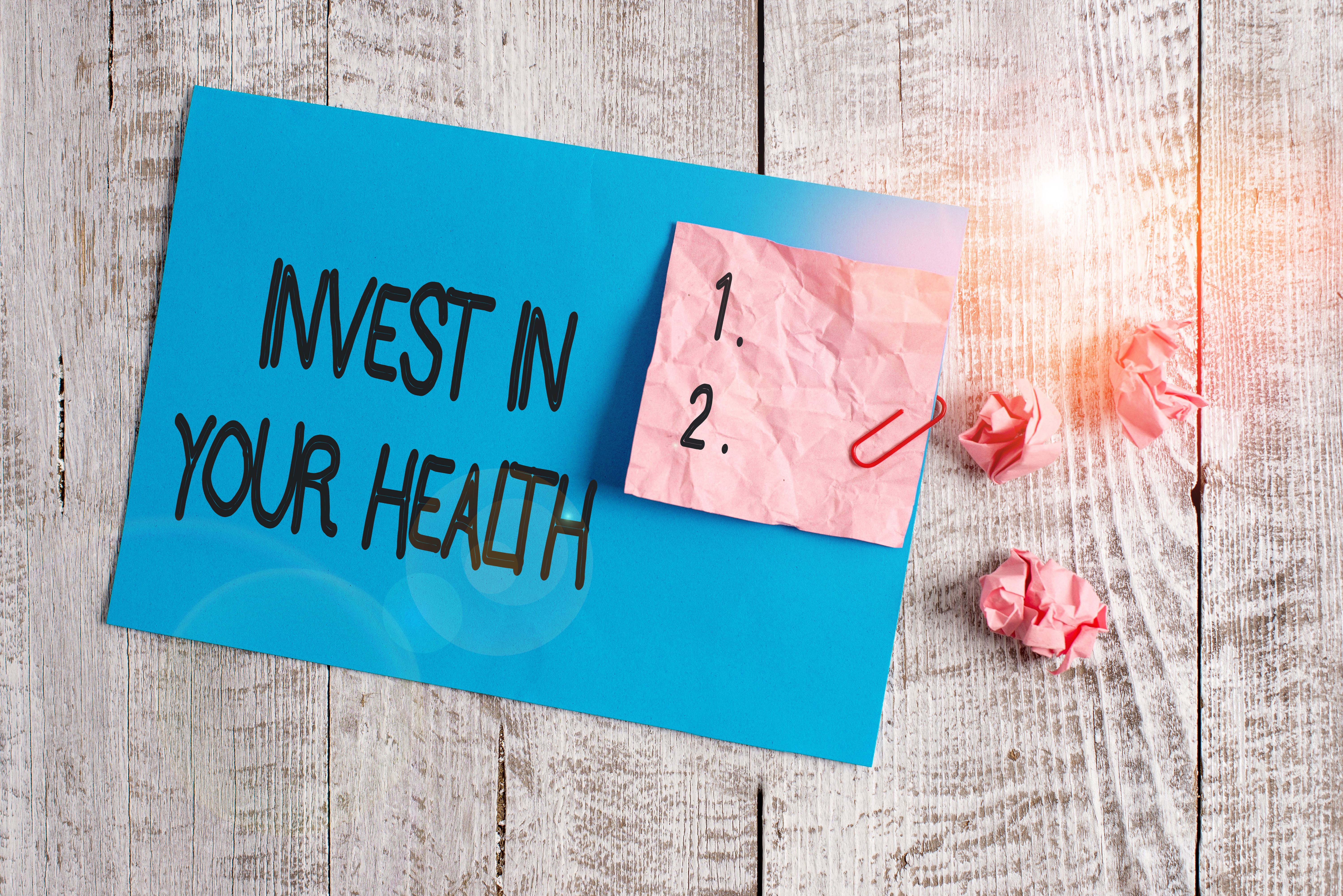 Invest in your health note on a desk